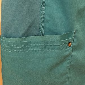 Healing Hands Purple Label yoga collection scrubs in Large and a teal color.